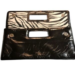 Gap black shiny clutch with zebra print inside